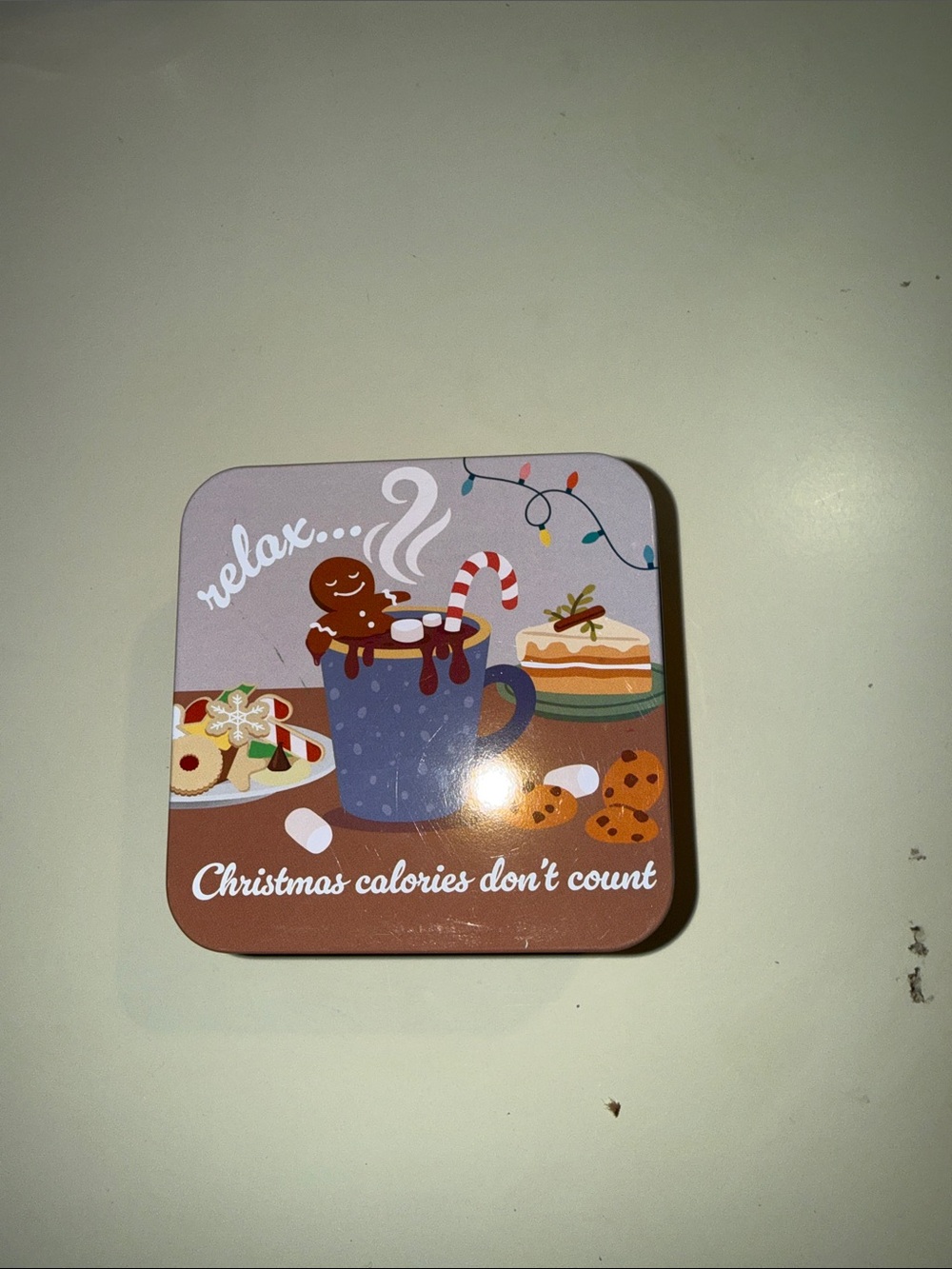Relax Christmas Cookie Tin - Festive Brown Holiday Treats contains puzzles